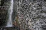 Waterfall and volcanic rock in Arusha National park, Tanzania